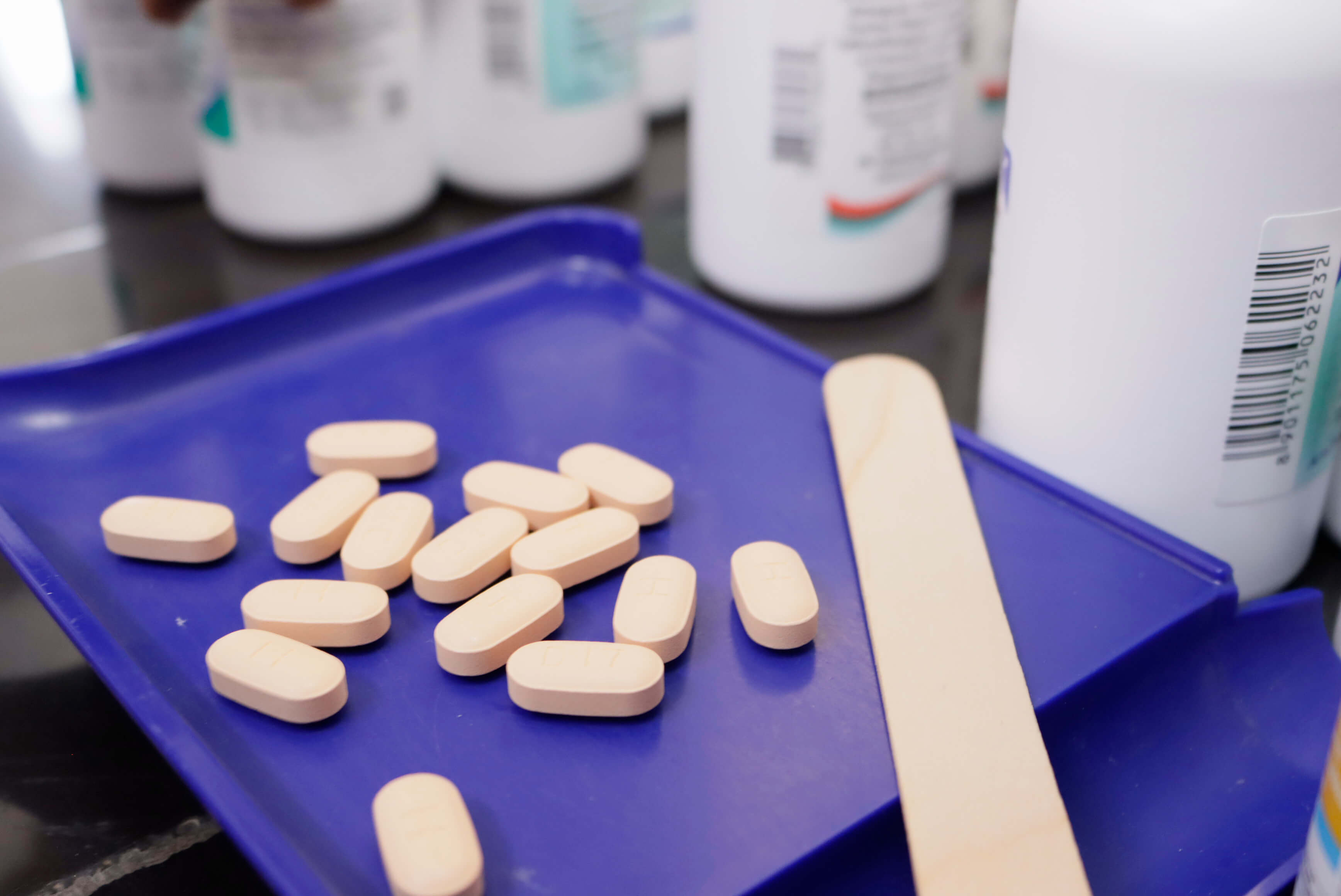 Tablets lay on a pharmacists tray 