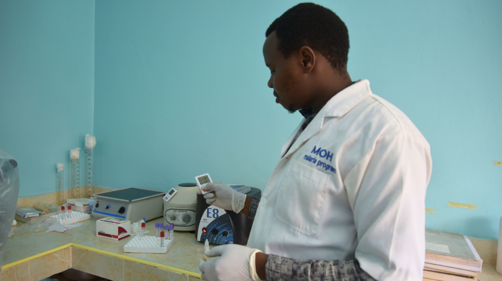 Lab person with stop watch